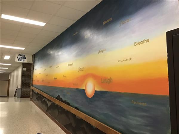 Sunset mural with words of positive messages like \